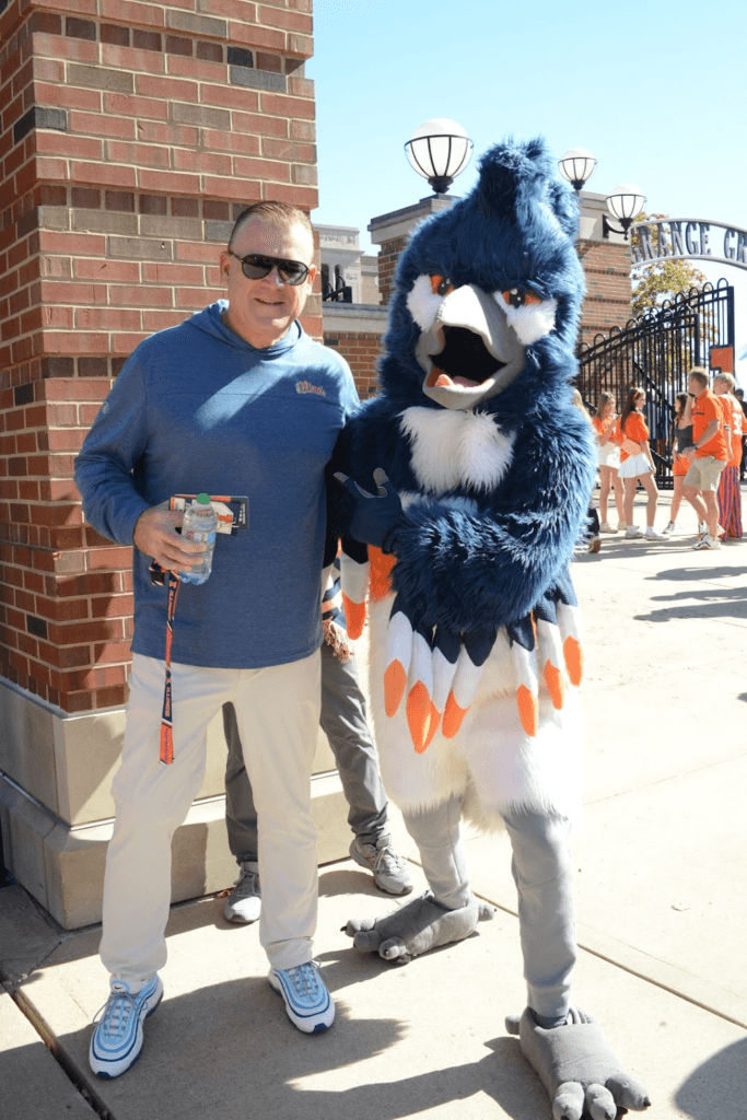 The Belted Kingfisher mascot with UIUC Coach Underwood