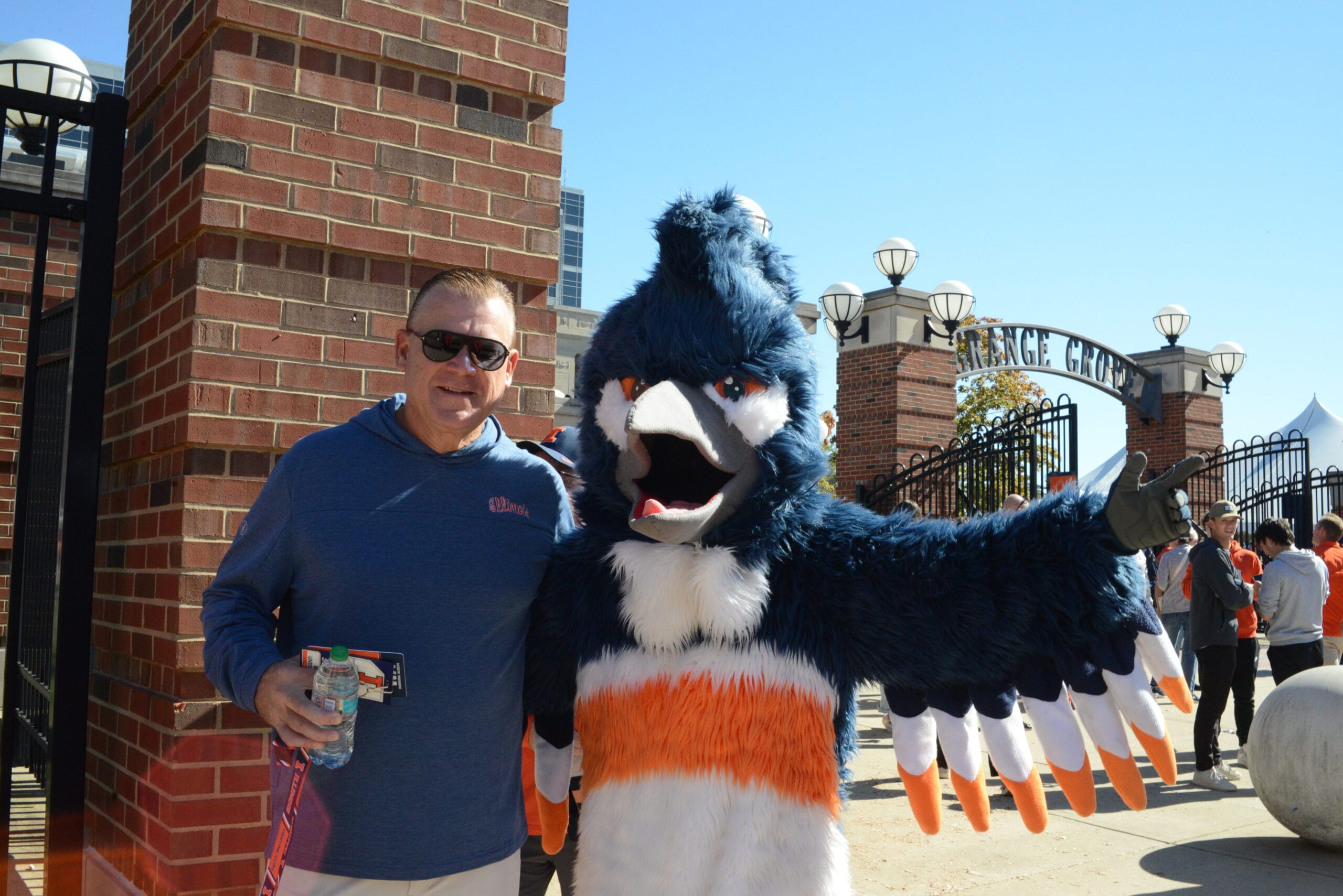 The Belted Kingfisher mascot posing together with Brad Underwood