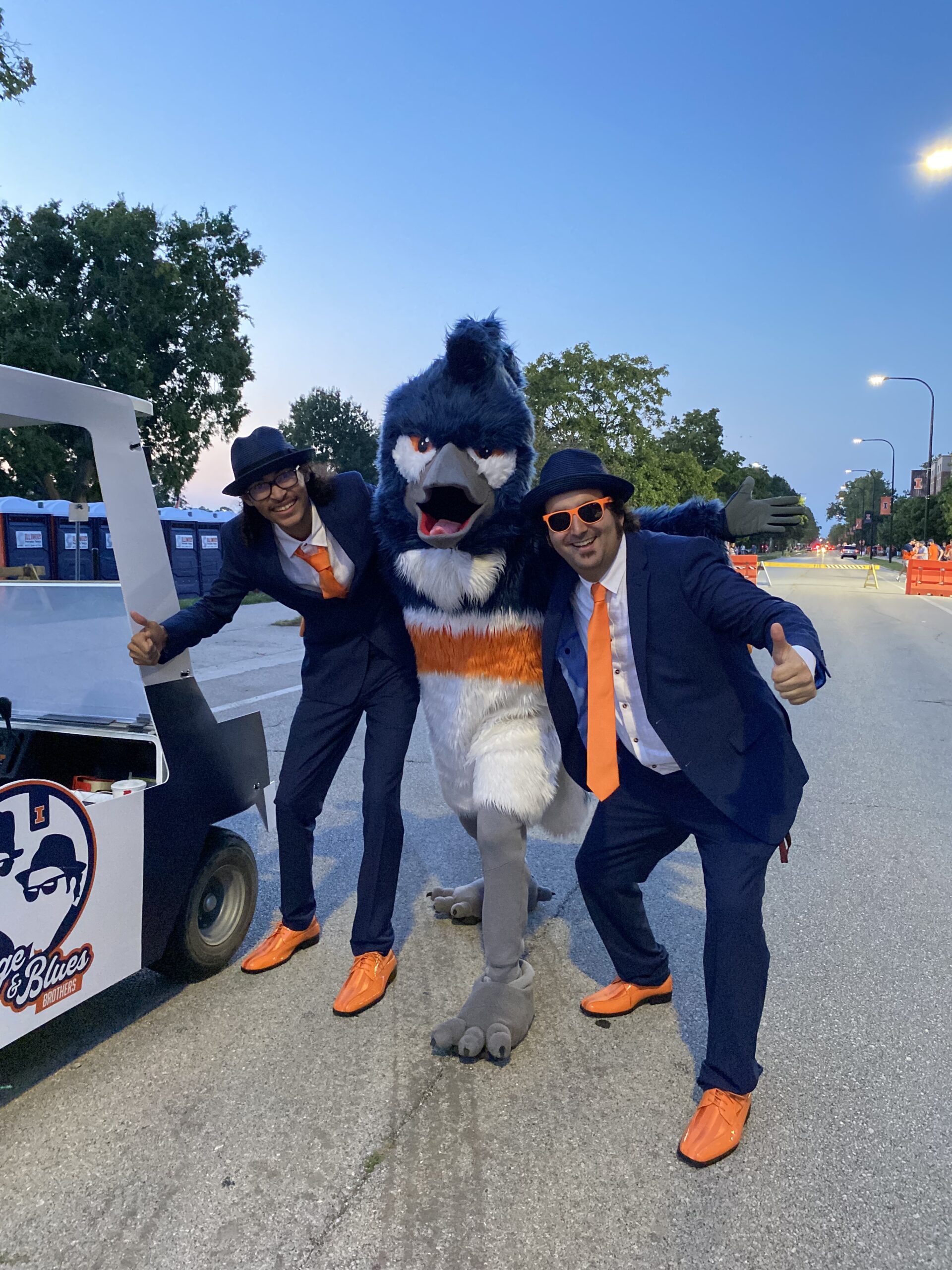 The Belted Kingfisher mascot posing with the Orange & Blues Brothers