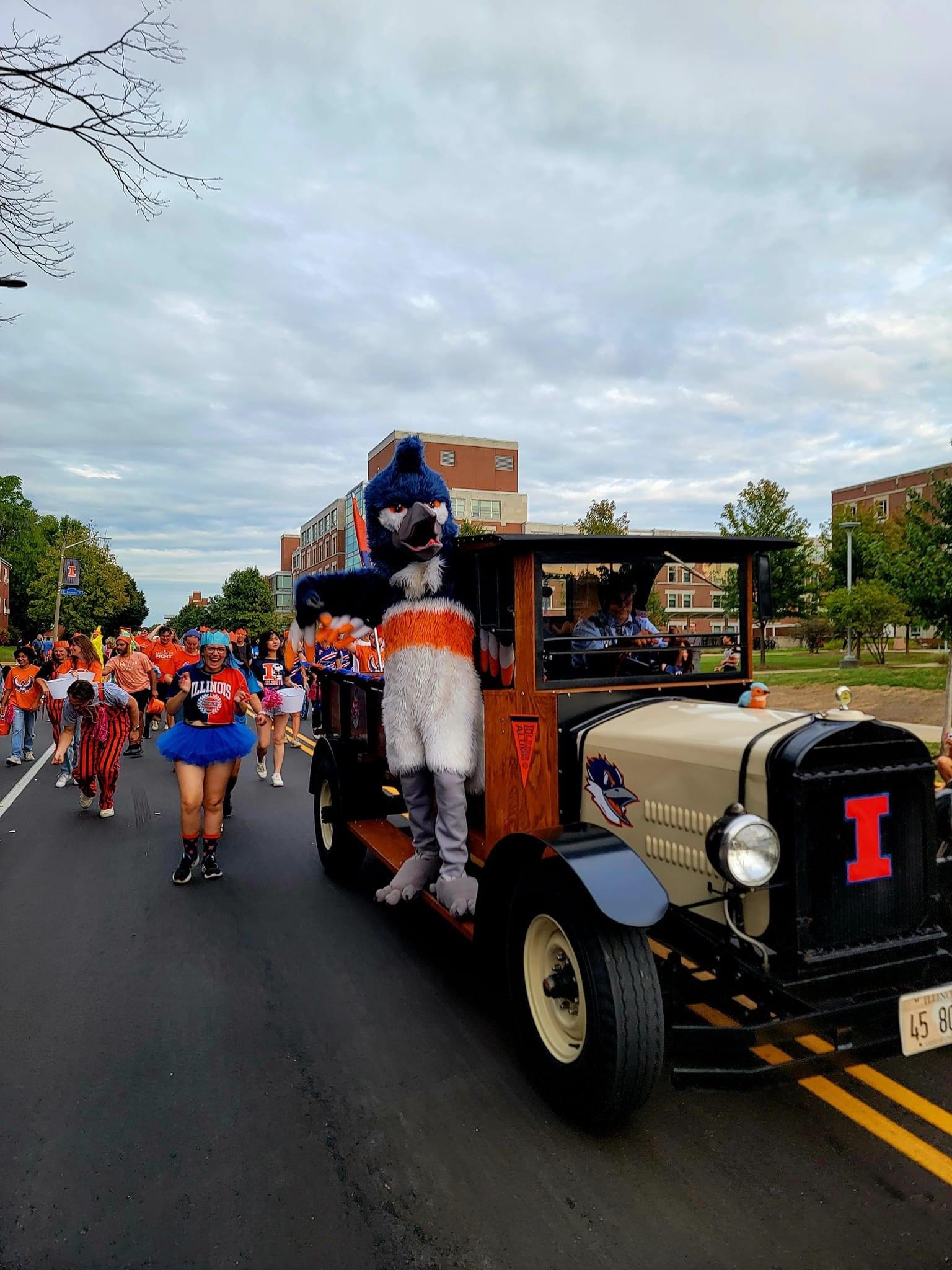 The Belted Kingfisher riding a tractor in the Illinois Homecoming Parade 2024