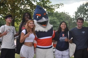Belted Kingfisher posing with four students