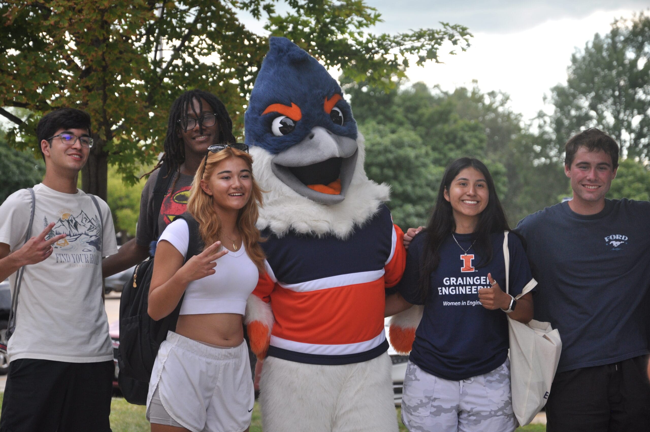 Belted Kingfisher posing with four students