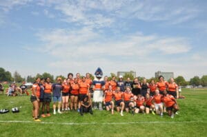 Belted Kingfisher posing together with the women's rugby team