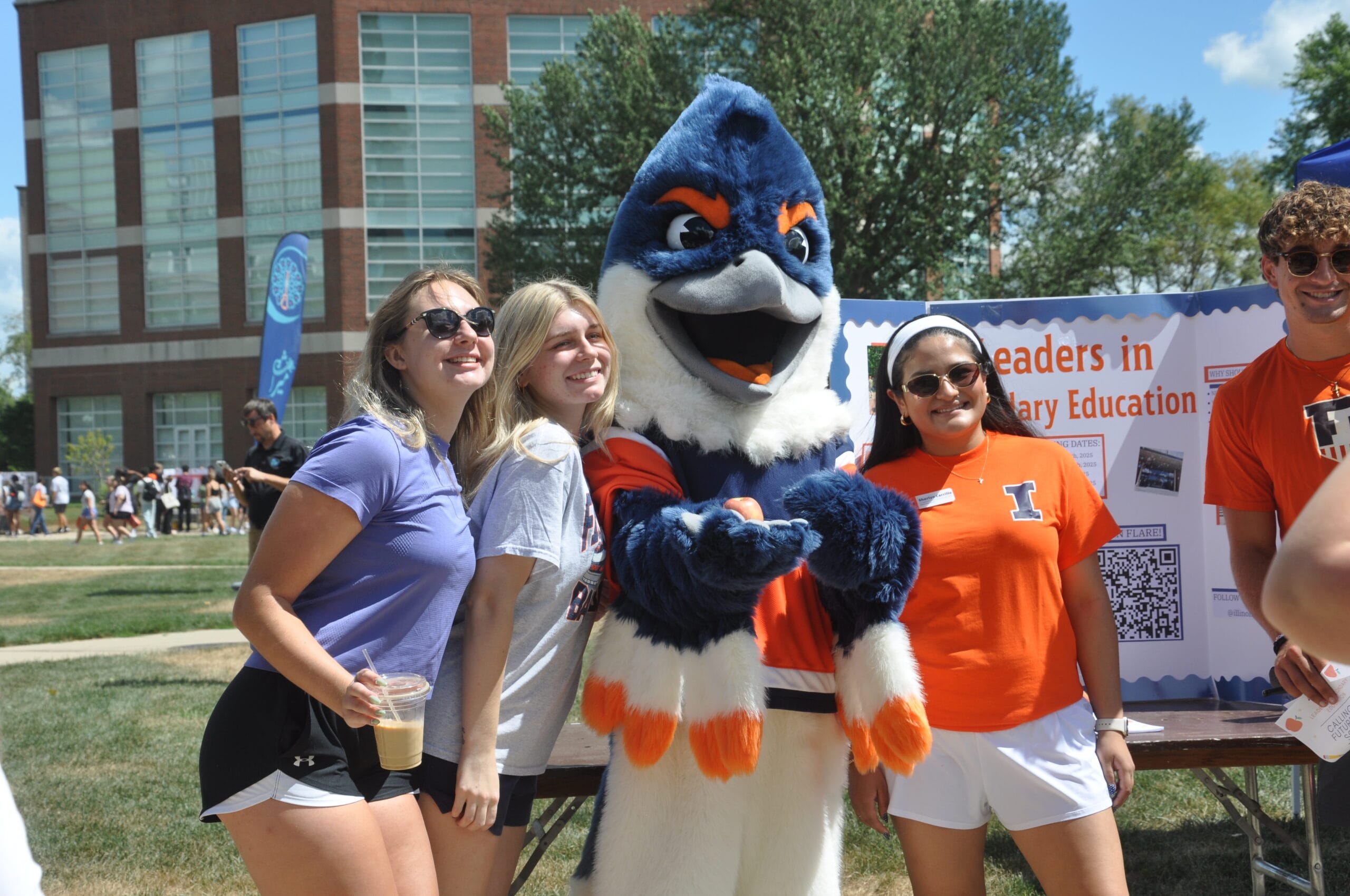 Belted Kingfisher posing with three students