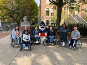 Belted Kingfisher with students in wheelchairs and members of the wheelchair basketball team