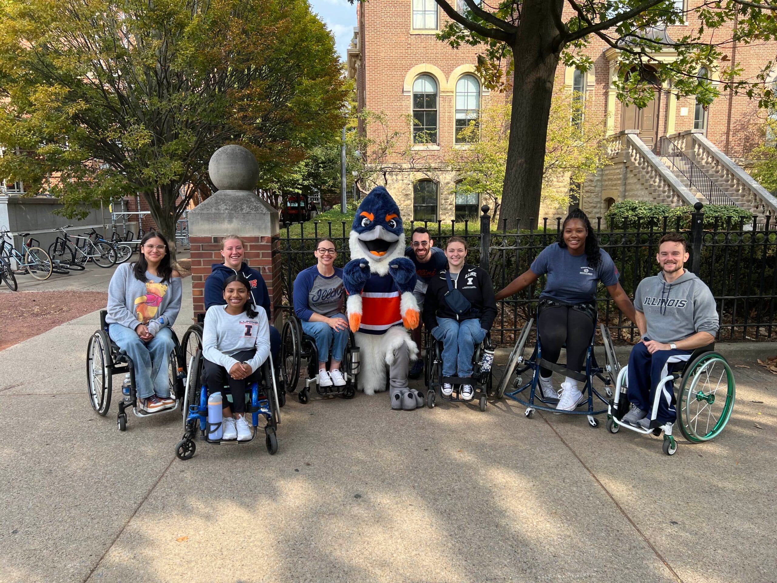 Belted Kingfisher with students in wheelchairs and members of the wheelchair basketball team